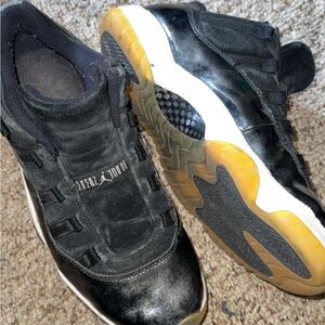 Jordan Black and White Athletic Shoes with Gold Accents